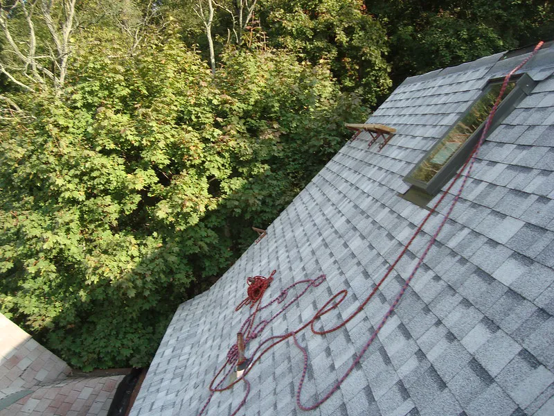 roofer making a targeted roof repair on a Port St Lucie home